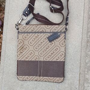 Coach Signature Stripe crossbody swingpack bag. 